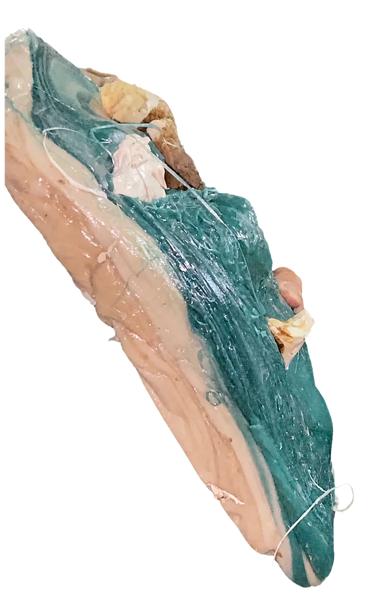 Side view showing the thick cross-section of a plastic purge lump.