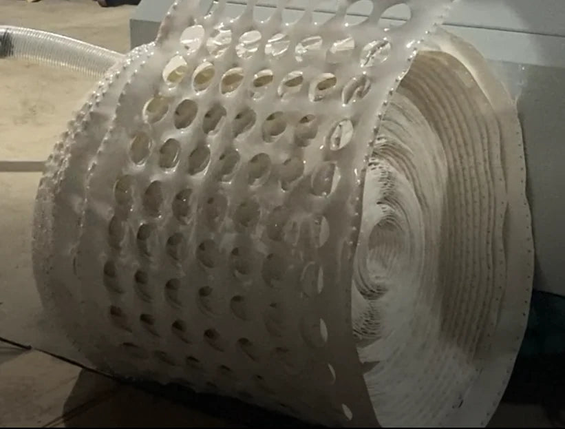 Plastic sheet collected in a roll for visual waste recognition.